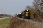 D702 heads for Wyoming Yard with a short train of bottom ash gondolas off the Michigan Shore